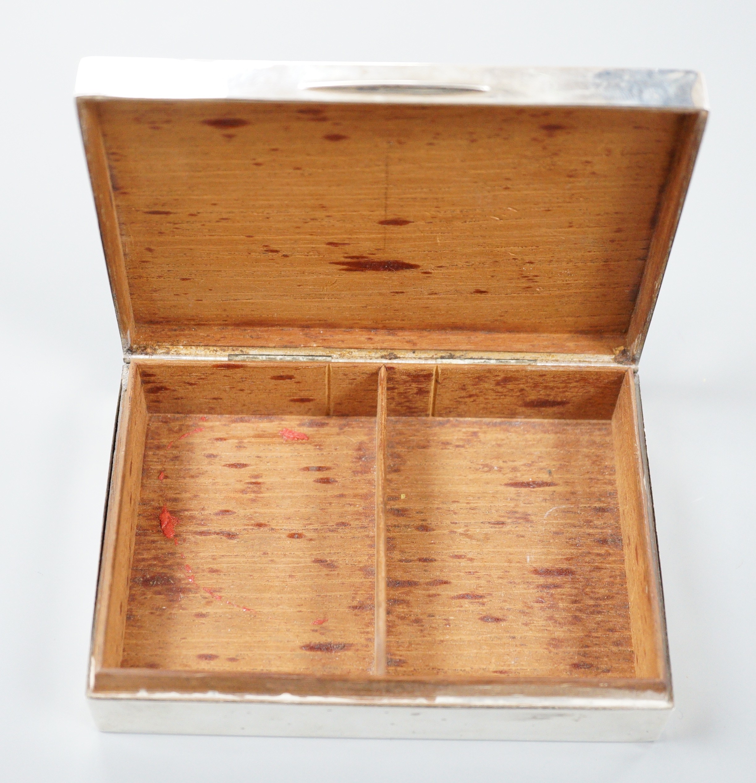 A George V engine turned silver rectangular cigarette box, Mappin & Webb, London, 1933, 12.8cm.